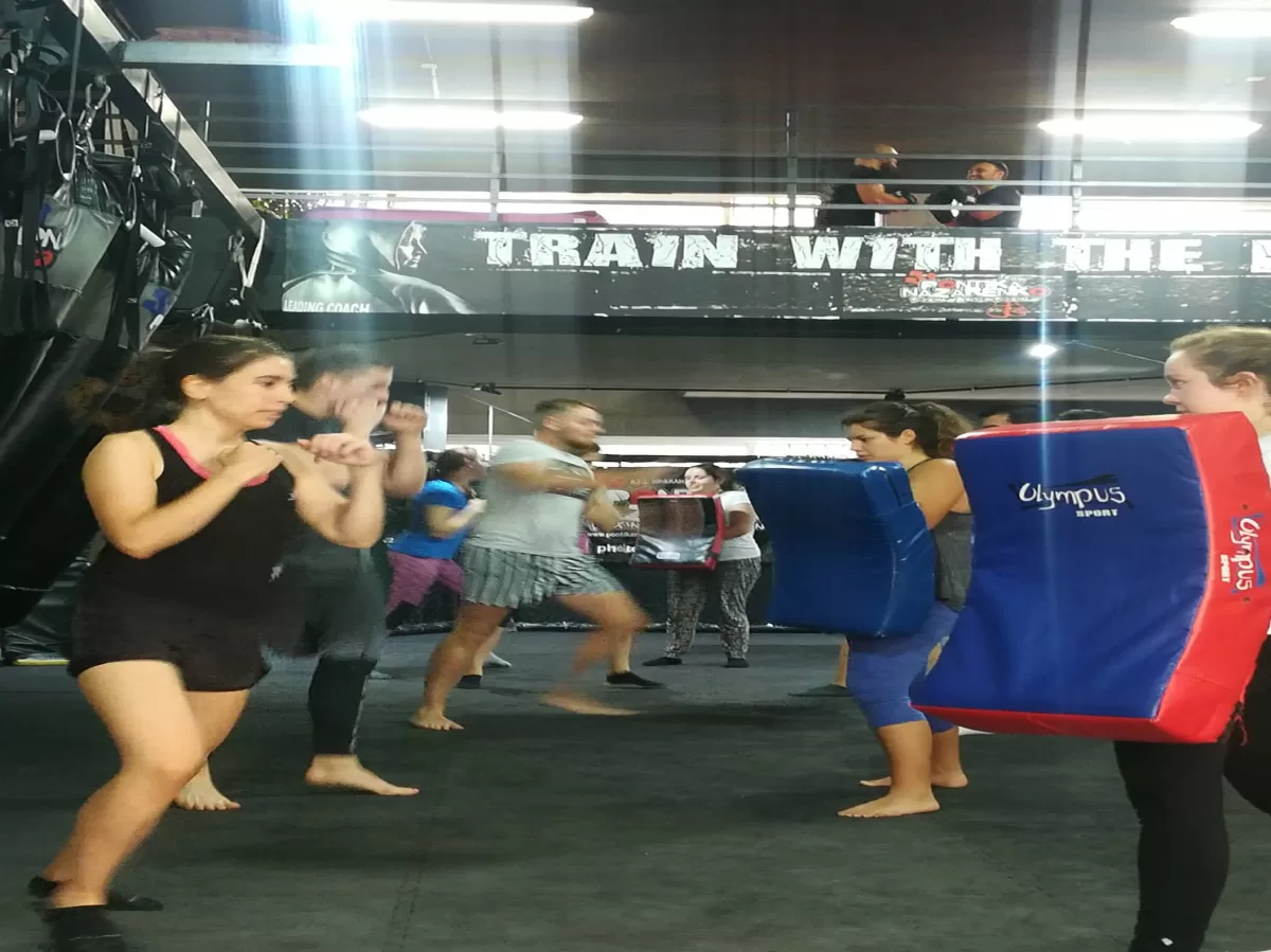 Participants kicking and punching the punching bags
