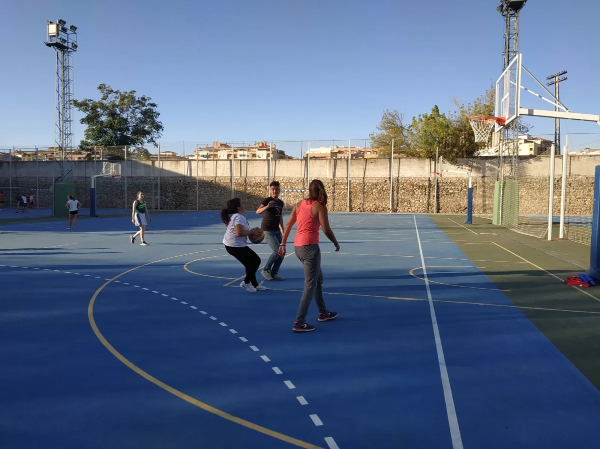 International and local students playing basketball