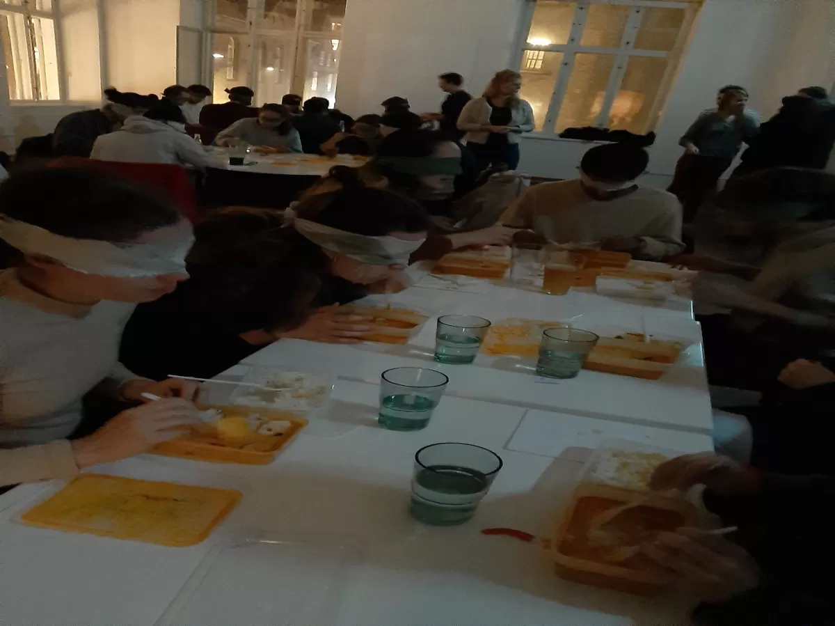 Participants eating dinner with blindfolds