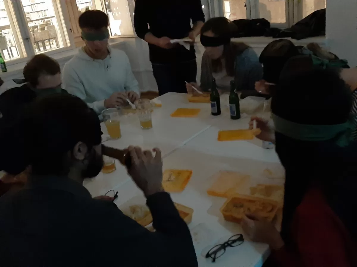 Participants eating dinner with blindfolds