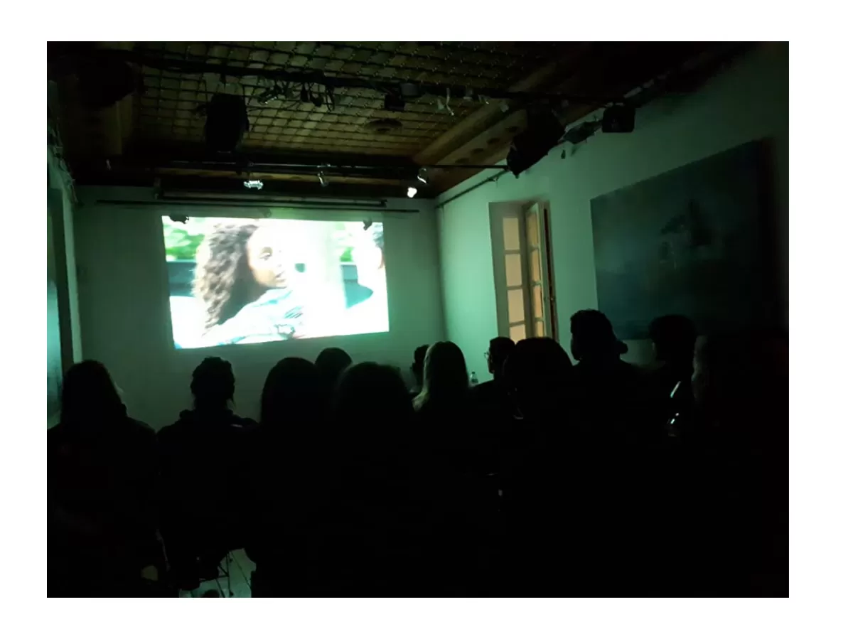 International students and volunteers watching the movie Infinitely Polar Bear