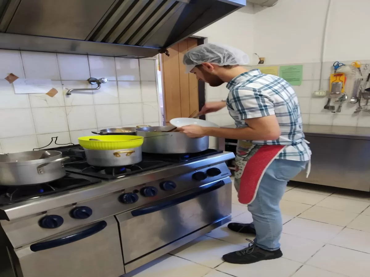 One International student preparing plates 