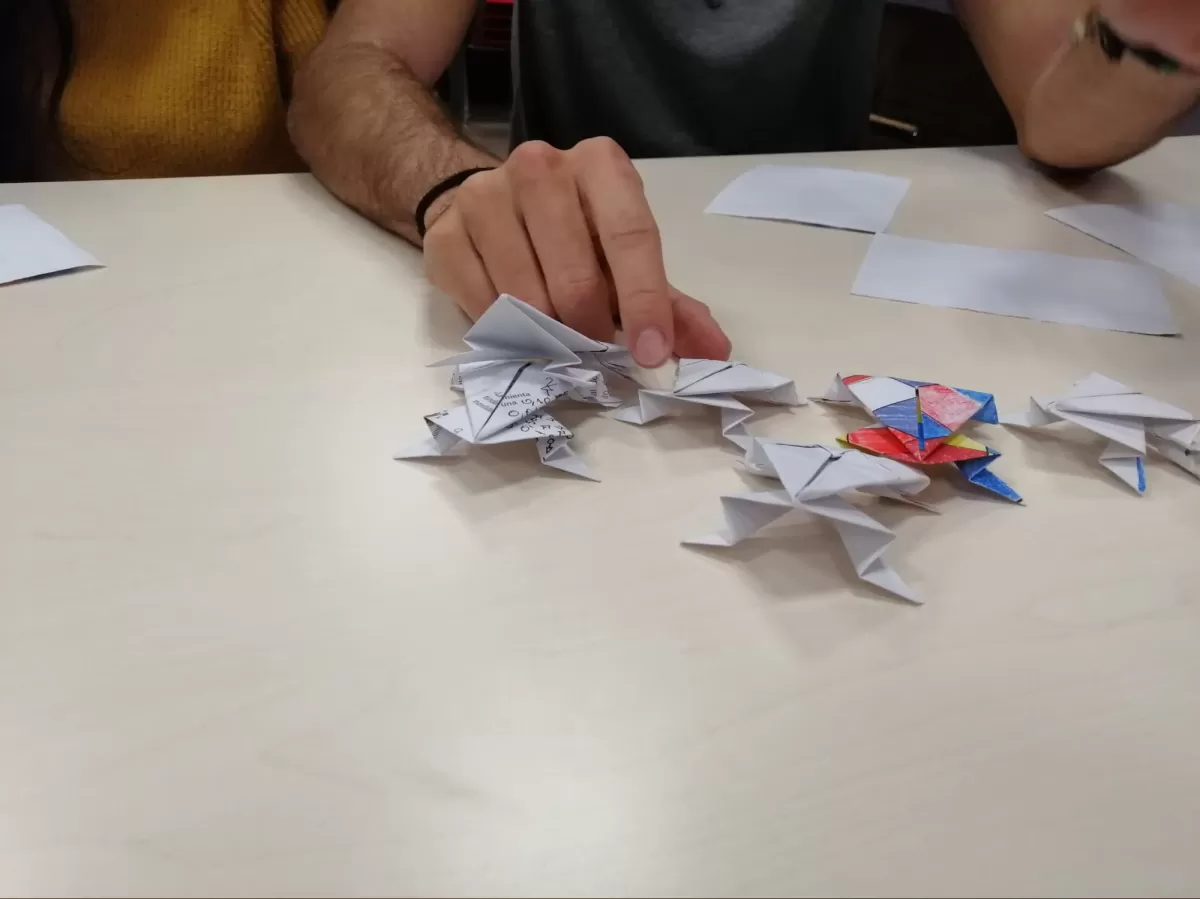 Several origami frogs on a table