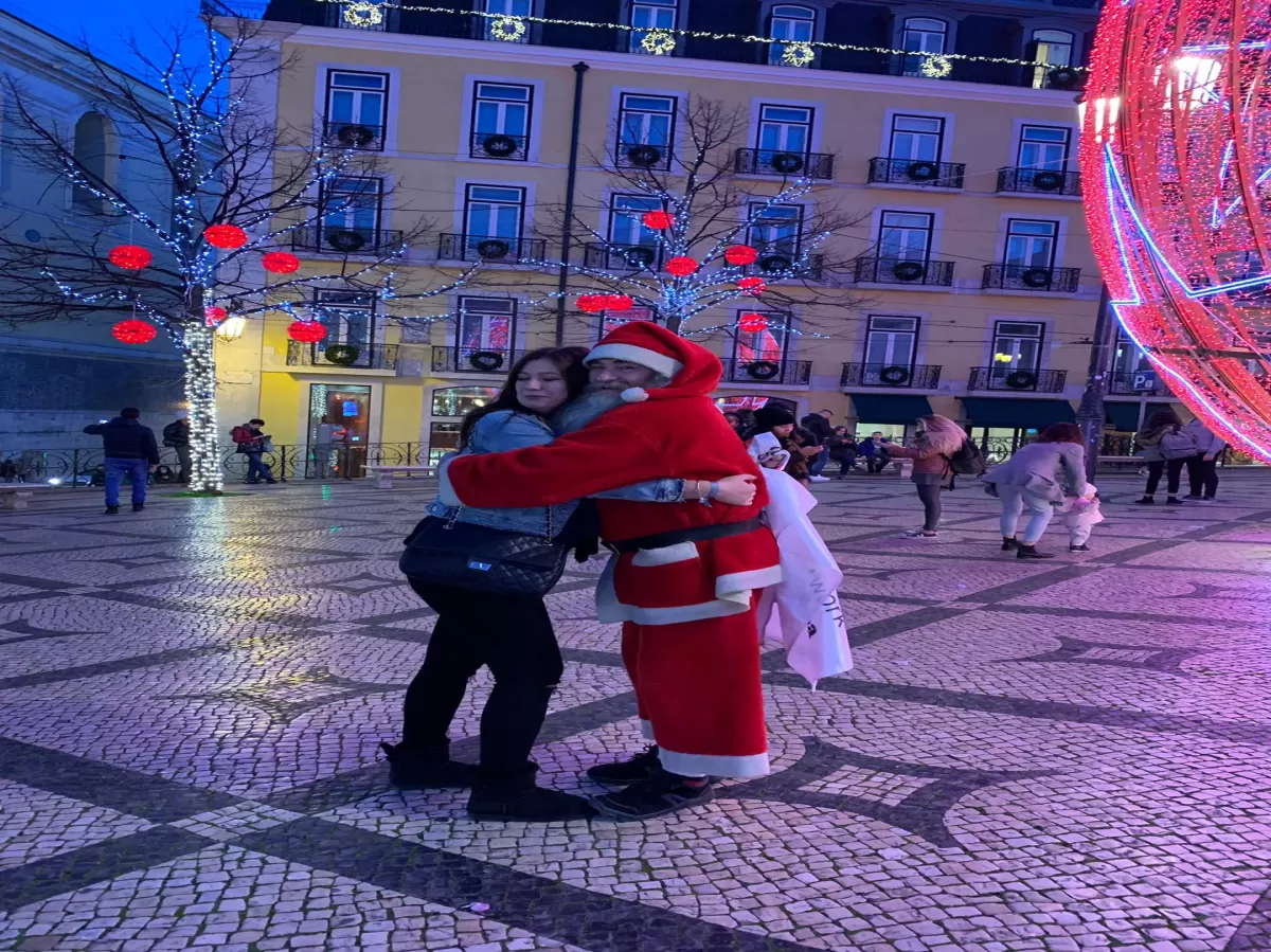 international student hugging Santa