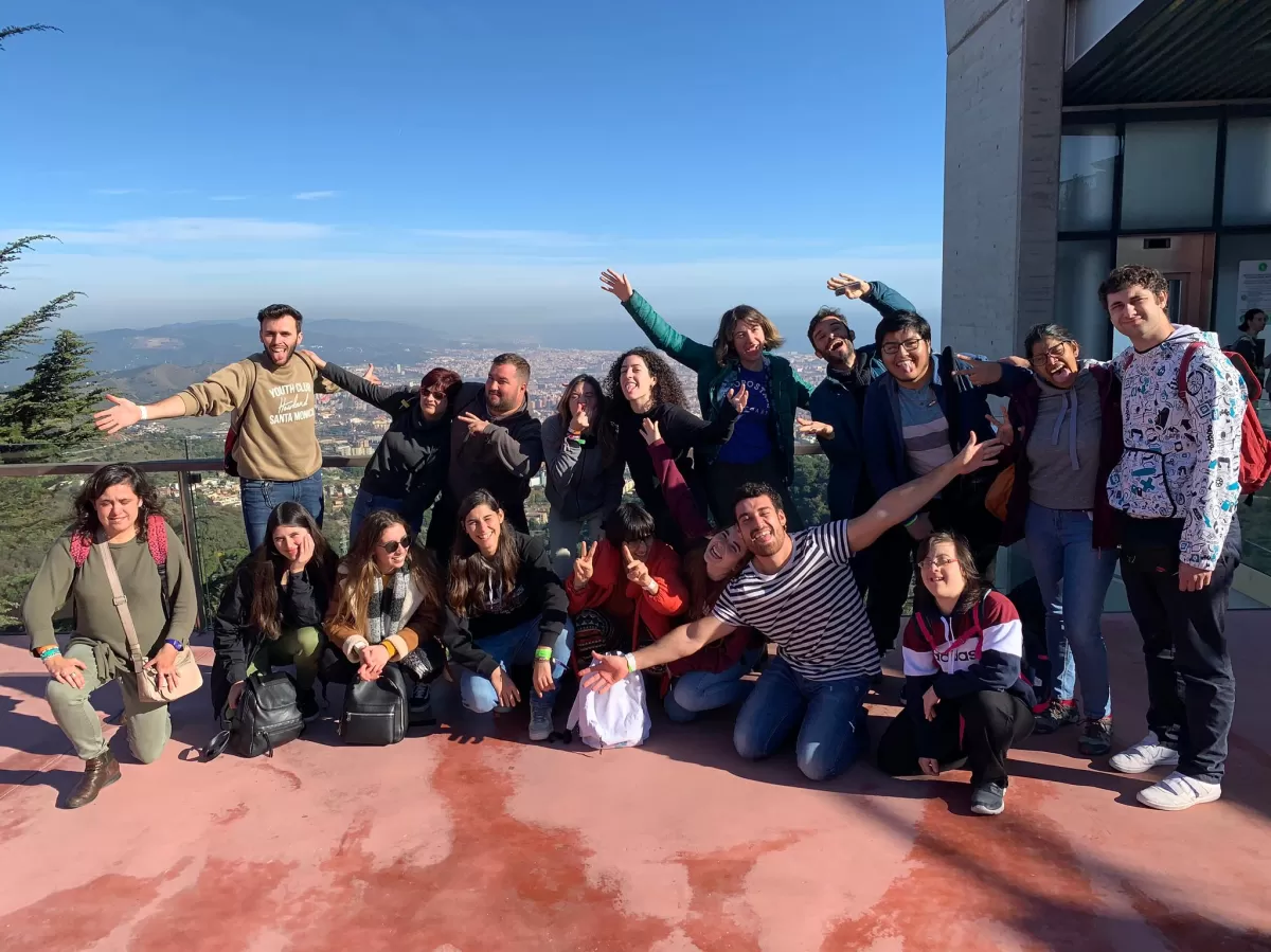 Erasmus Students, ESN Coordinators and Ludàlia members posing under the sun in front of amazing Barcelona views