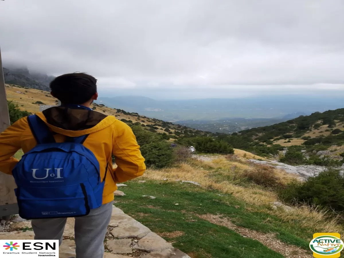 A student watching the view from the mountain.
