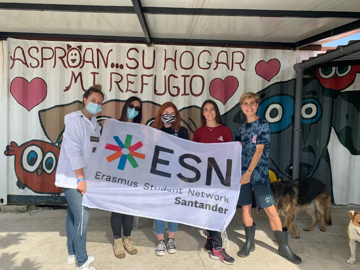 International students at the dog shelter with ESN flag