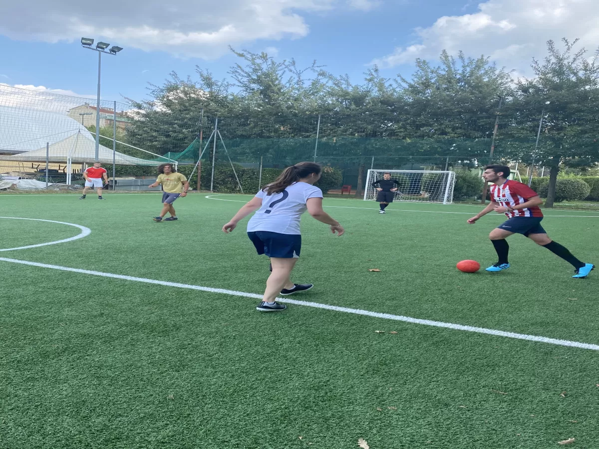 Group of international students playing football