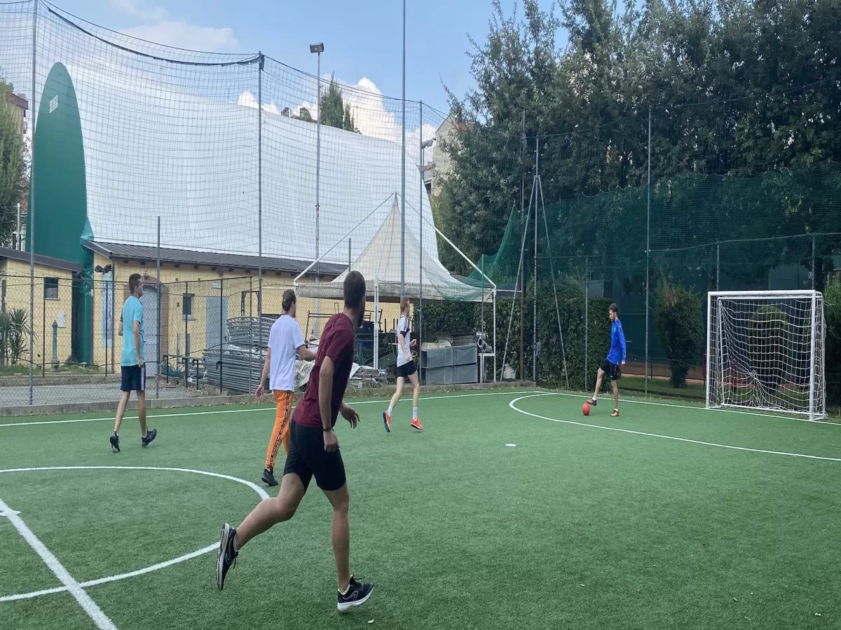 Group of international students and ESNers playing Football
