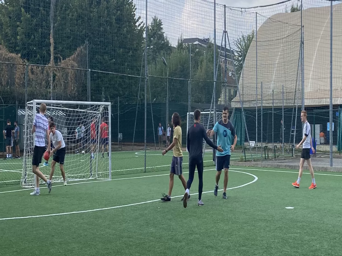 Group of international students and ESNers playing Football