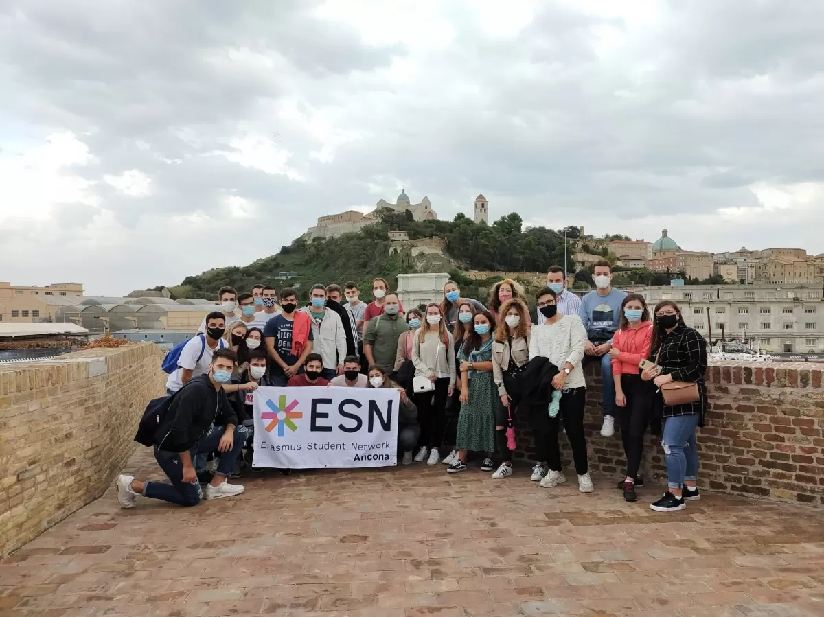 Group of students and volunteers on the ancient walls of the harbor
