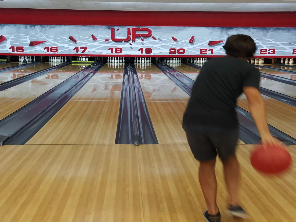 International student playing bowling