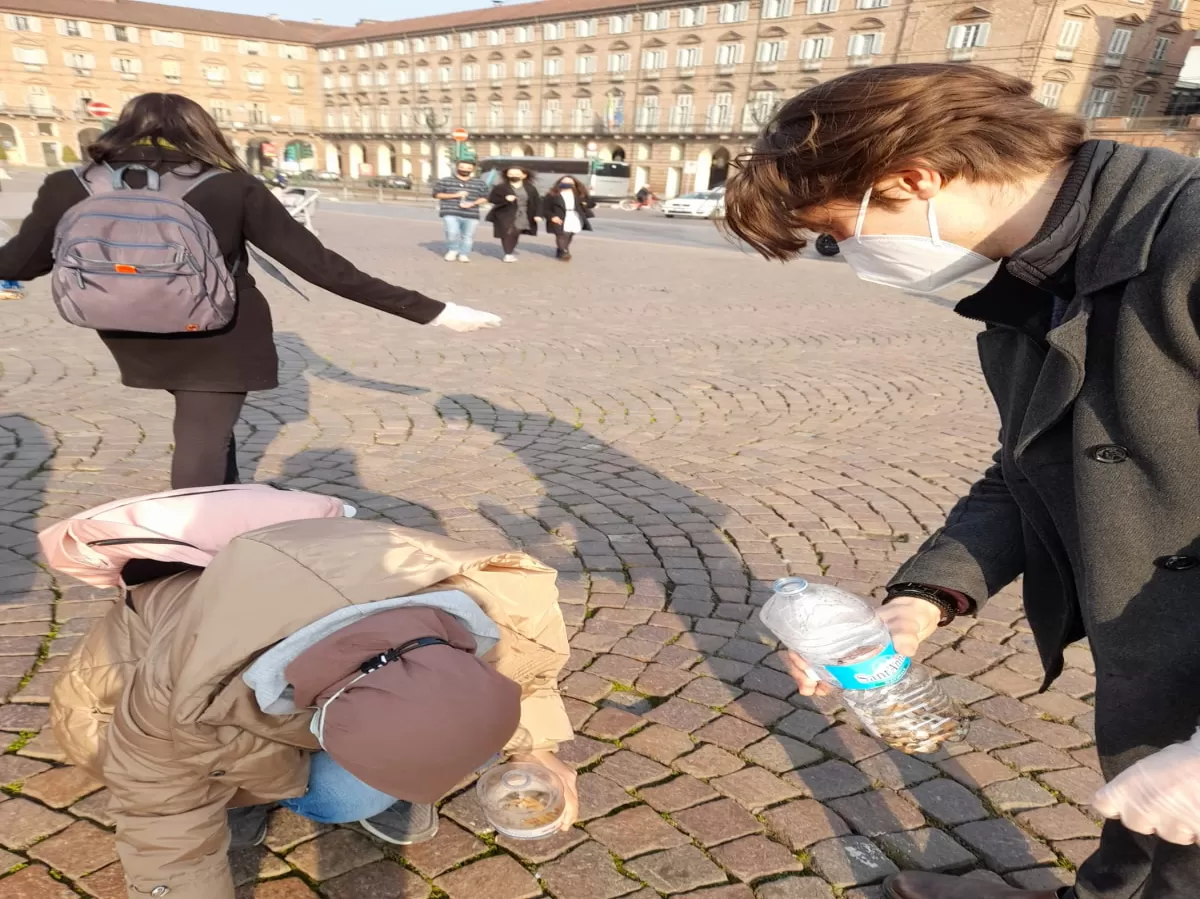 Erasmus students take cigarettes and put in the plastic bottle
