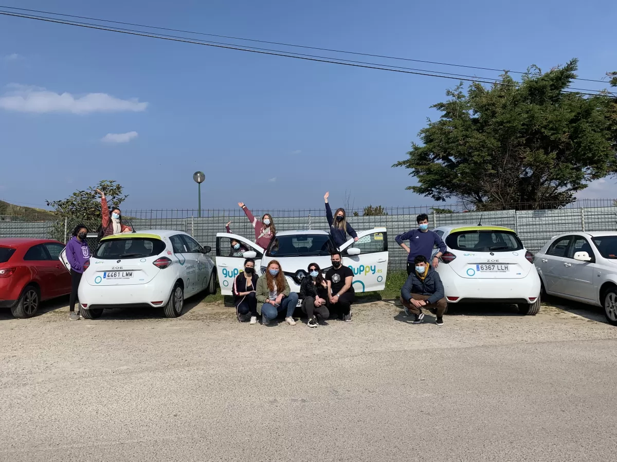 ERASMUS students with the electric cars