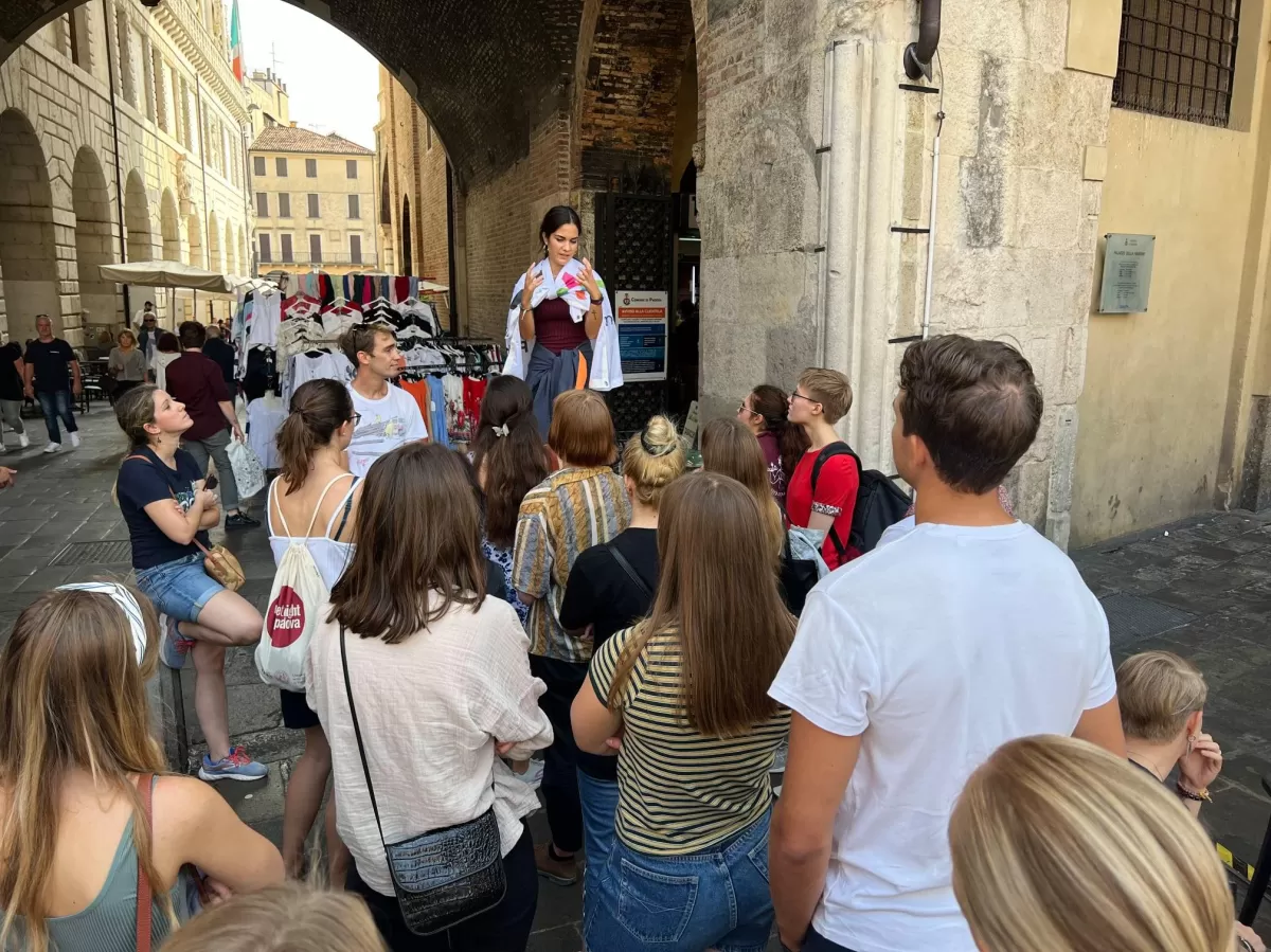 International students listening to the history of Palazzo della Ragione