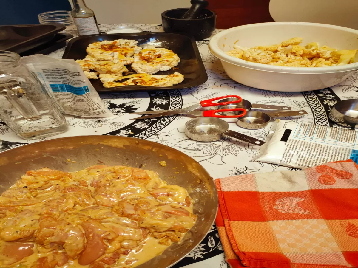Marinating chicken and cauliflower about to go in oven