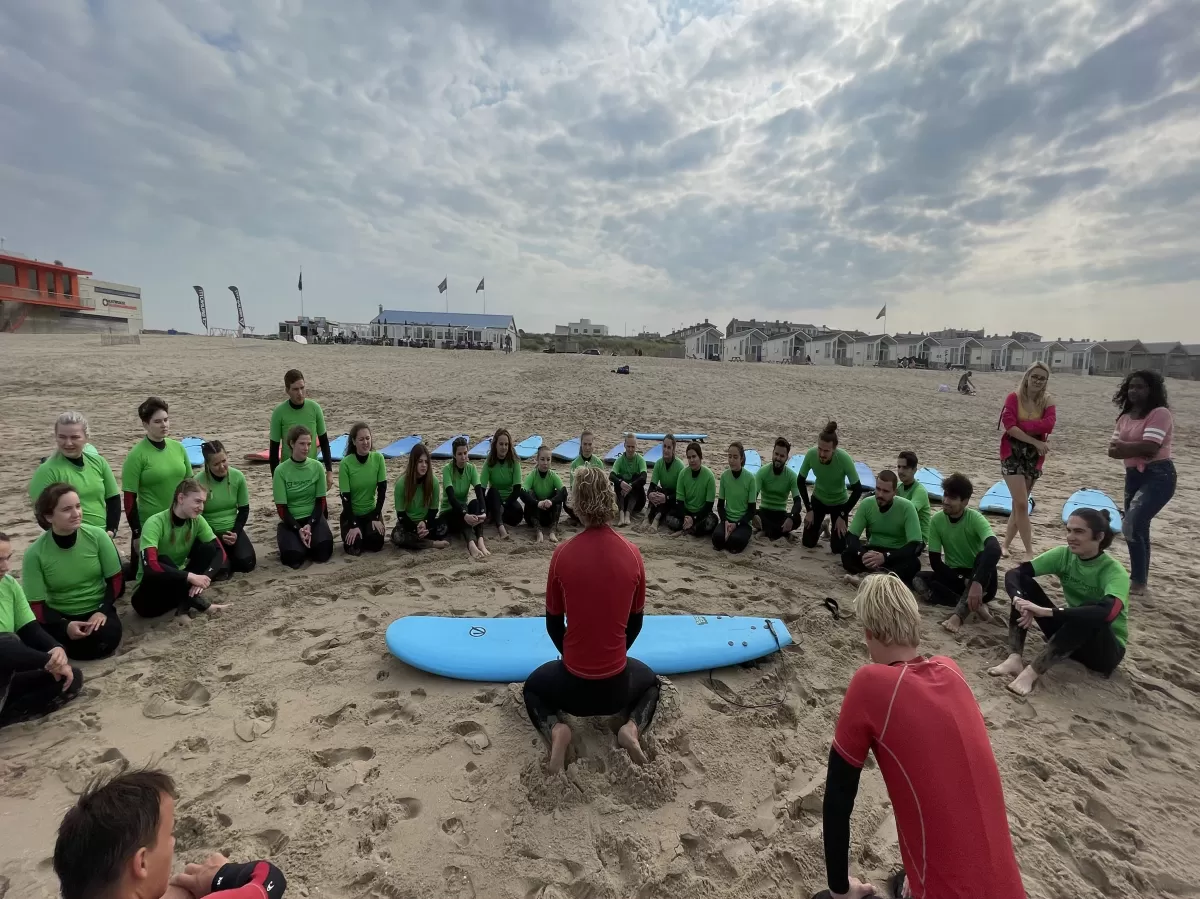 Instructors explaining surfing 