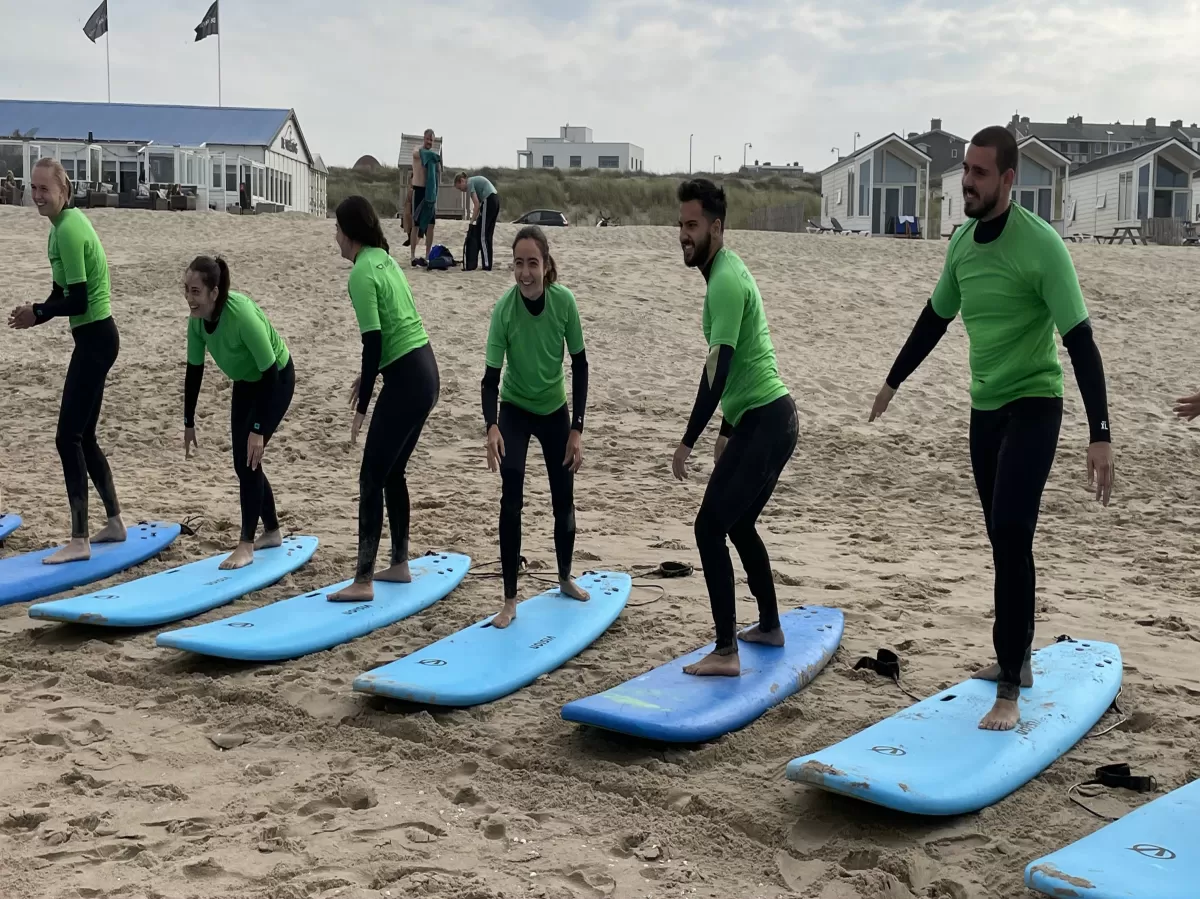 Practicing standing up on the board on the beach