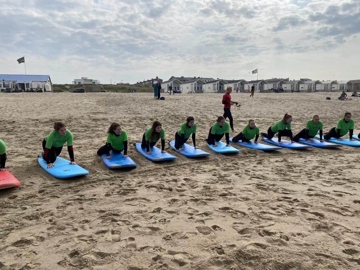 Practicing paddling on the beach