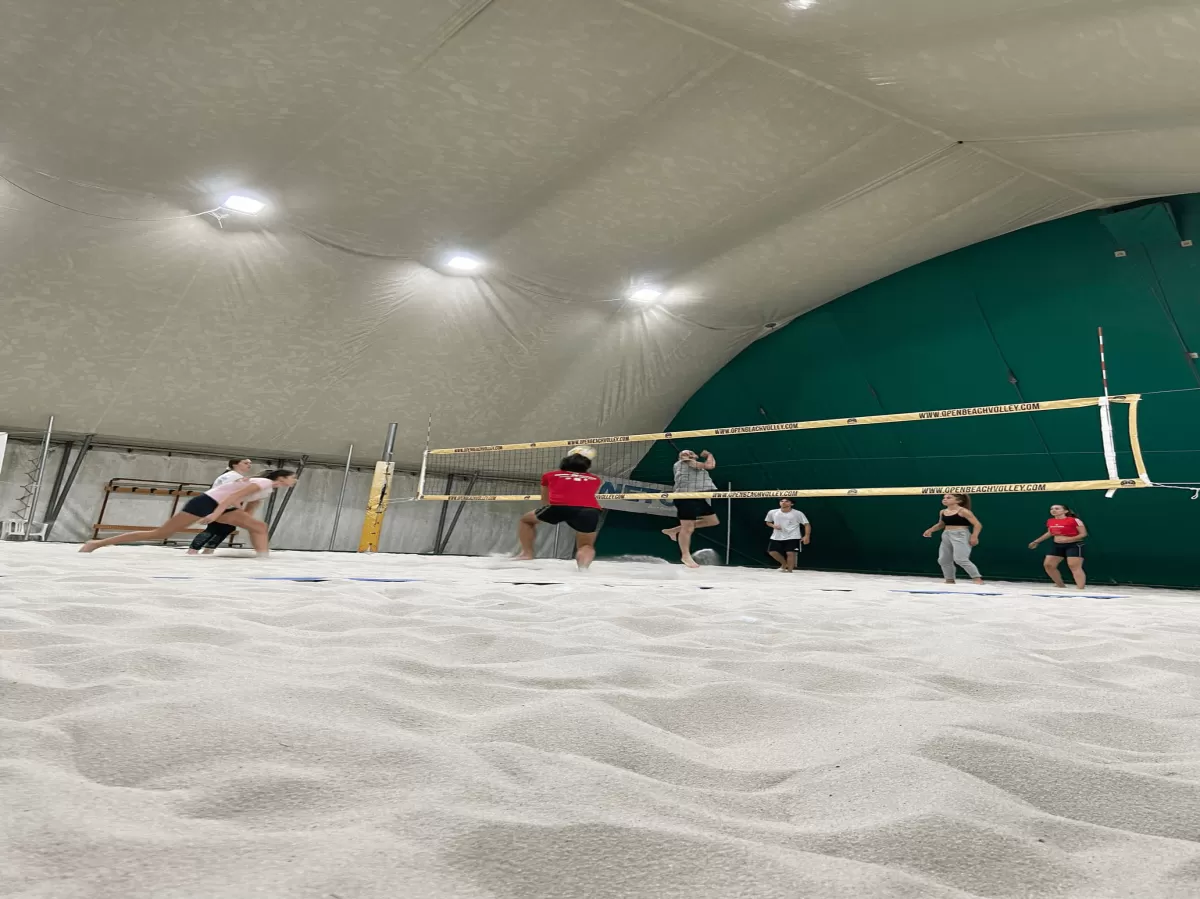 guys playing beach volley indoor