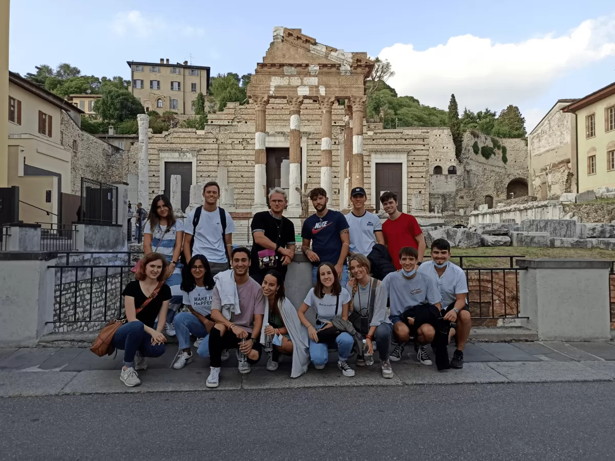 Erasmus students in front of Capitolium monument in Brescia