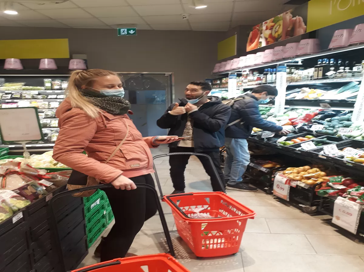 Erasmus in a supermarket buying food for poor people.