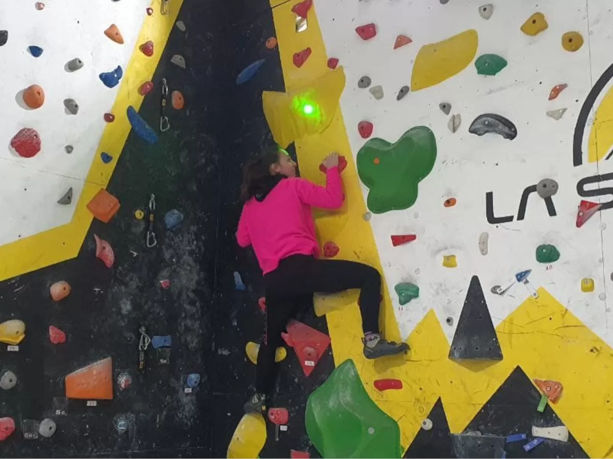a girl climbing the wall