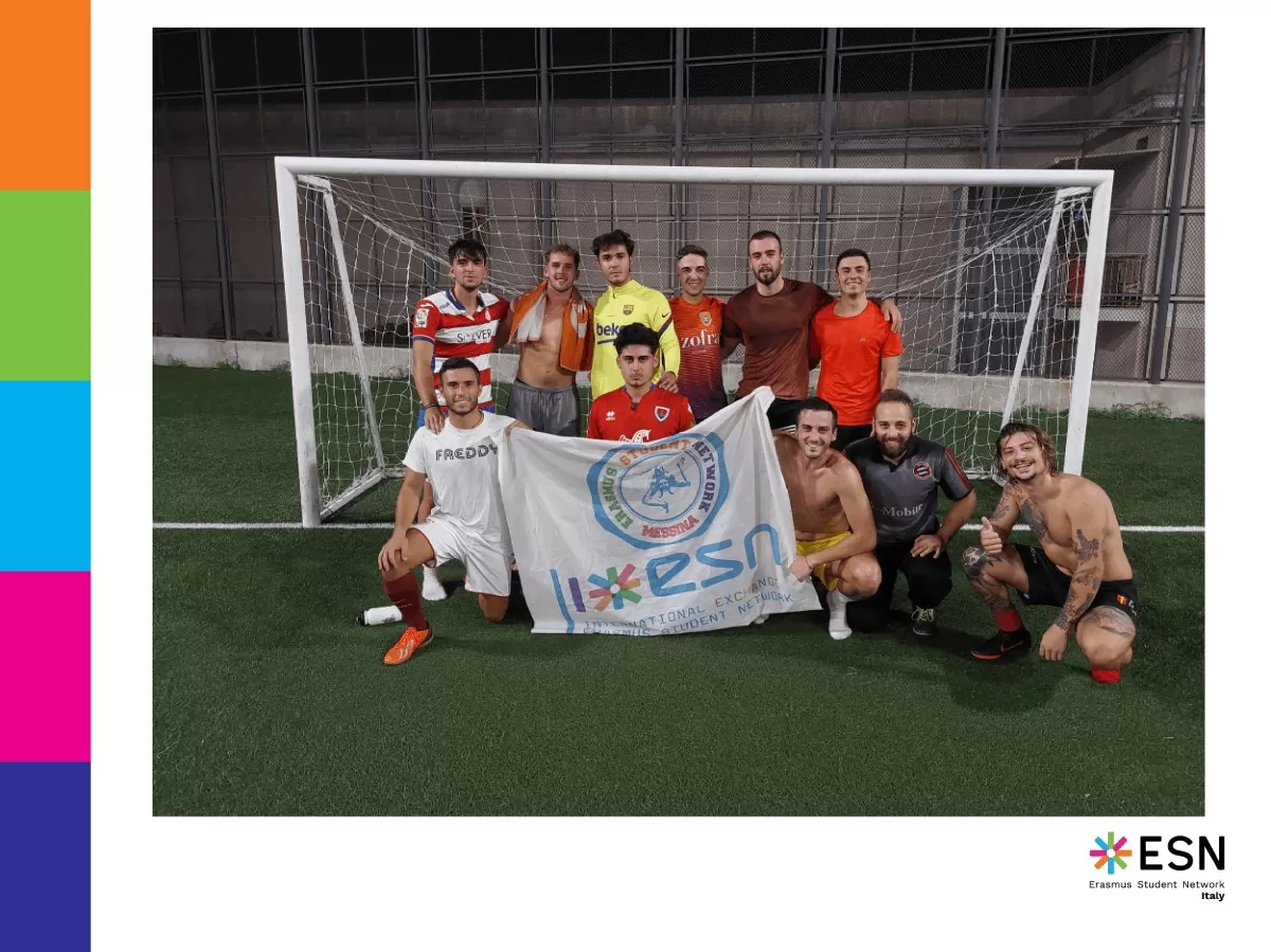 Group photo next to the football goal with ESN Messina flag