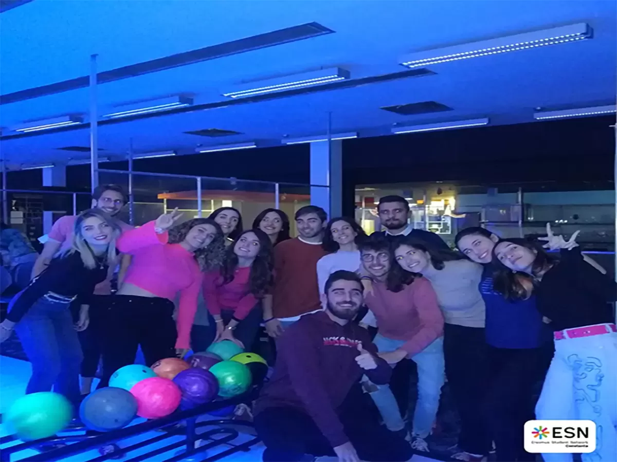 Group photo of students playing pool