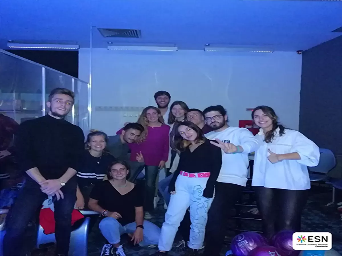 Group photo of students playing pool