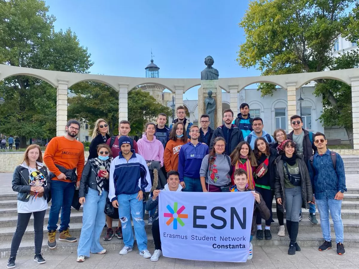 group photo of erasmus students in front of historical buildings