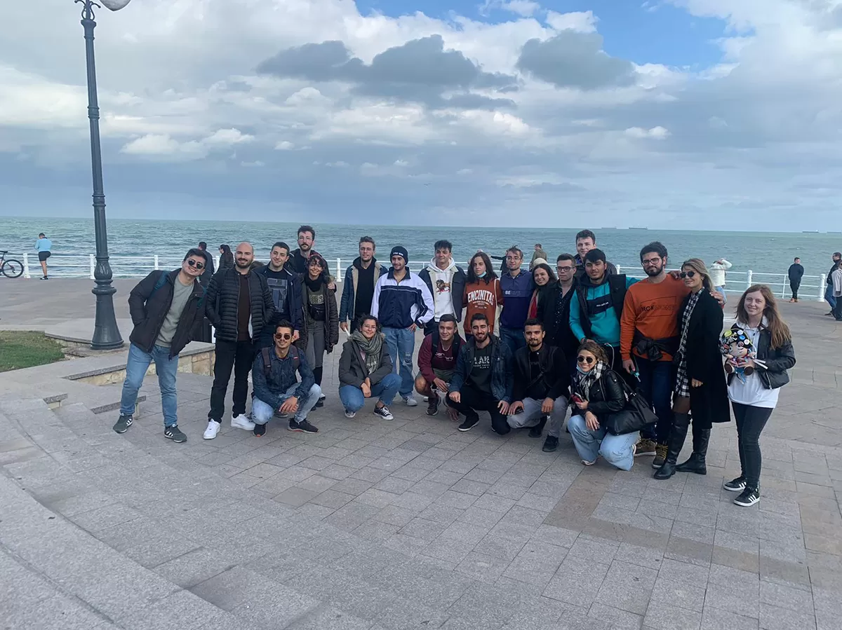 group photo of erasmus students in front of historical buildings
