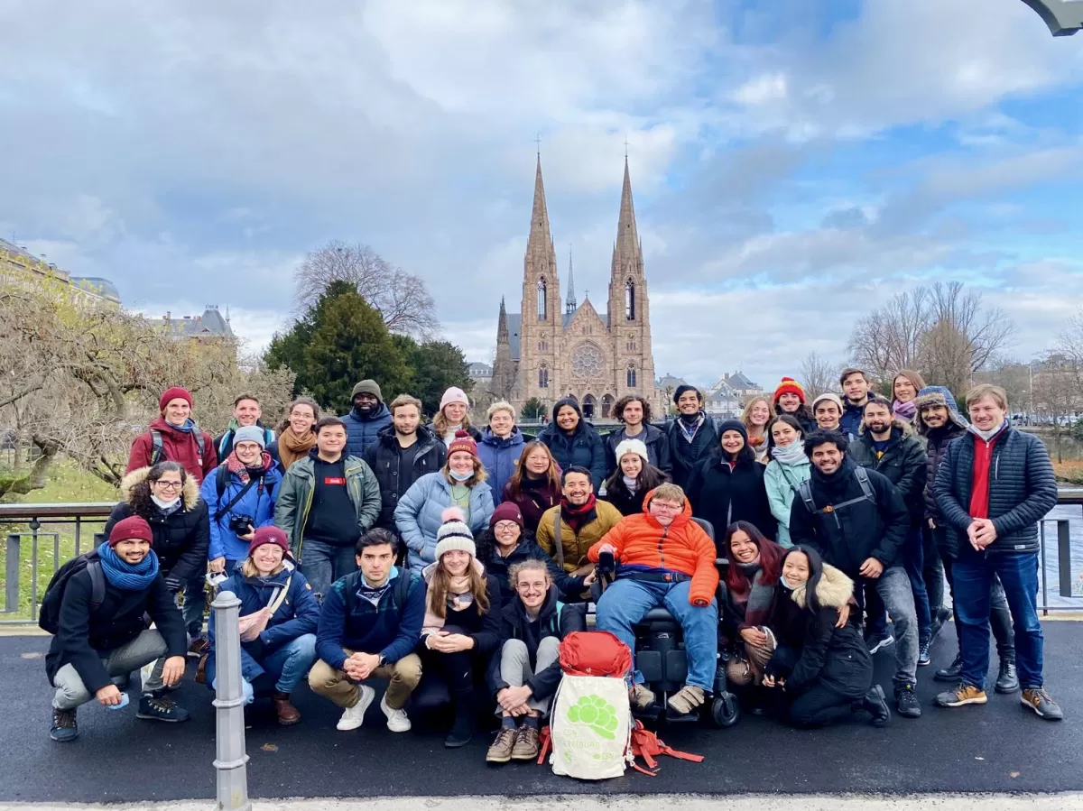 The participants took a group photo with the cathedral in the background