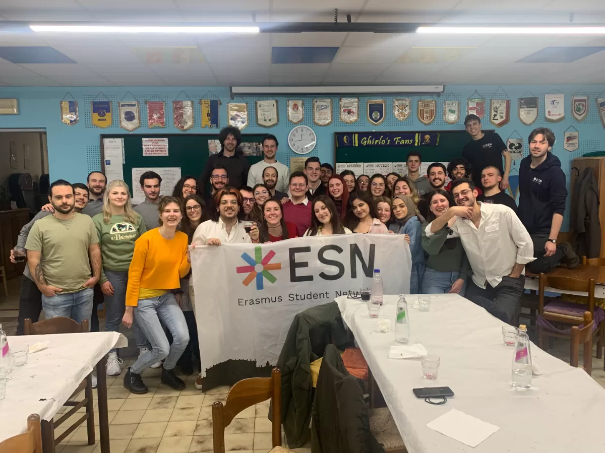 a group of international studens posing with the ESN Modena flag
