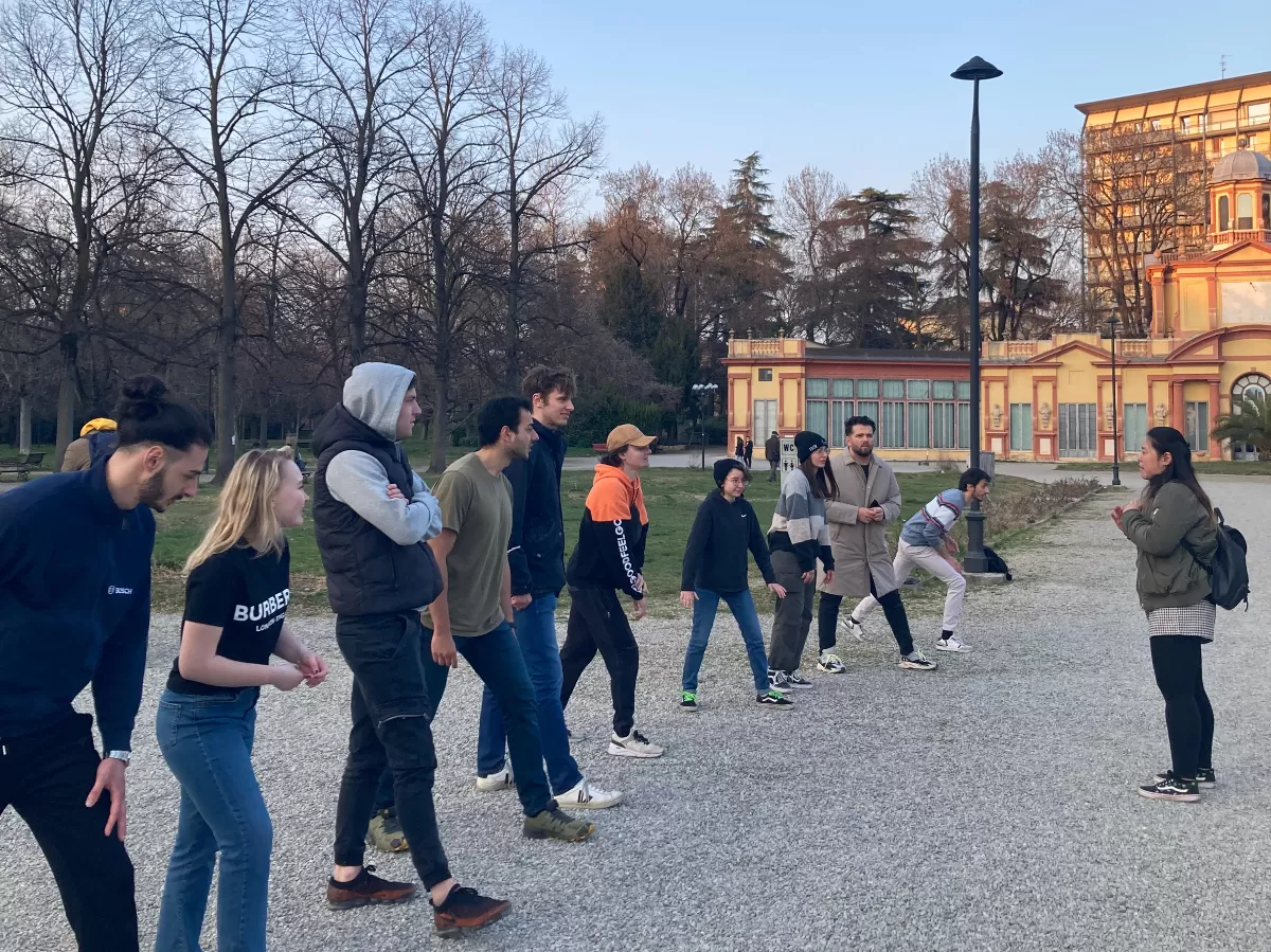 group of students getting compete in a game of statues