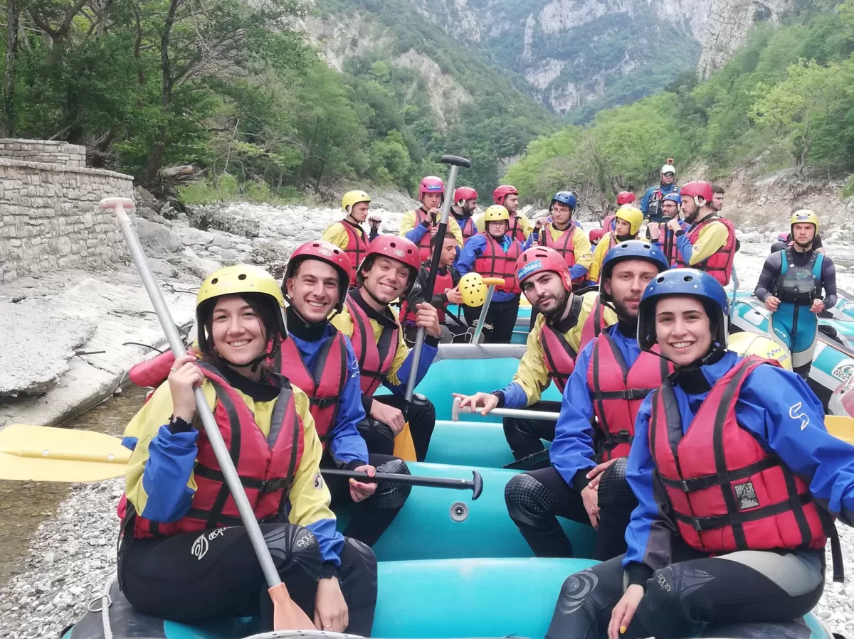 students in the coat during the rafting