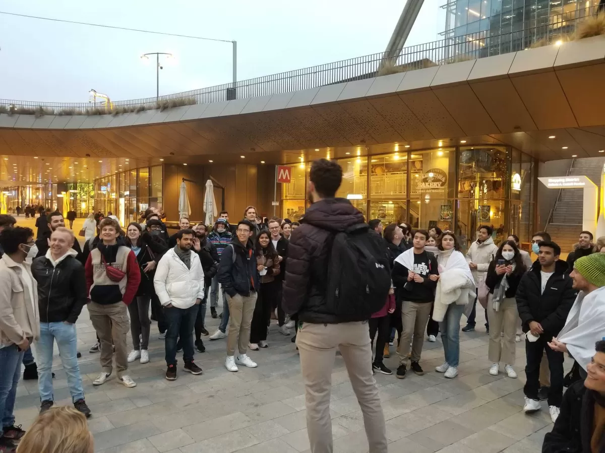 Group of international students listening to a ESN guide in CityLife square