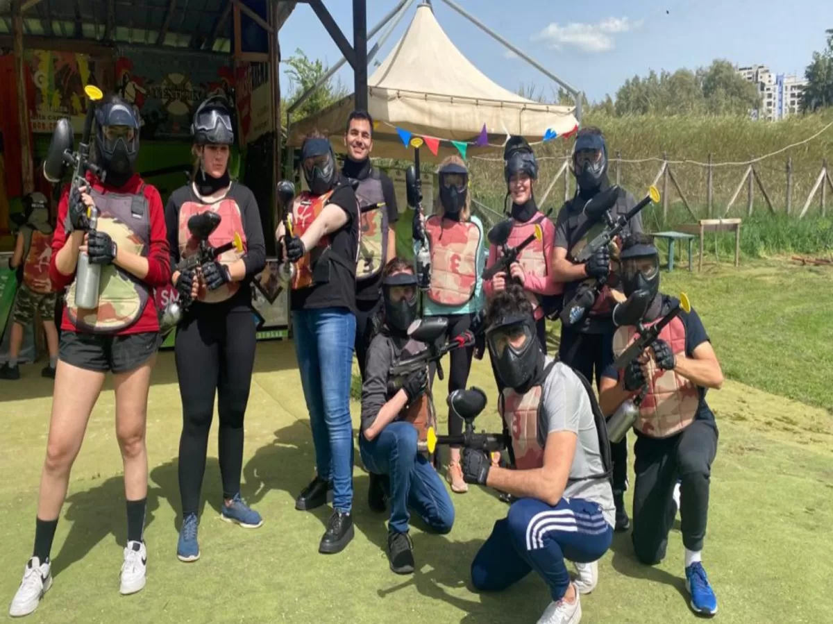 players posing with paintball suits