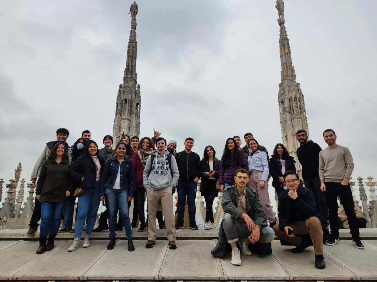 Group of international students and ESN volunteers posing on the terraces of Duomo Cathedral