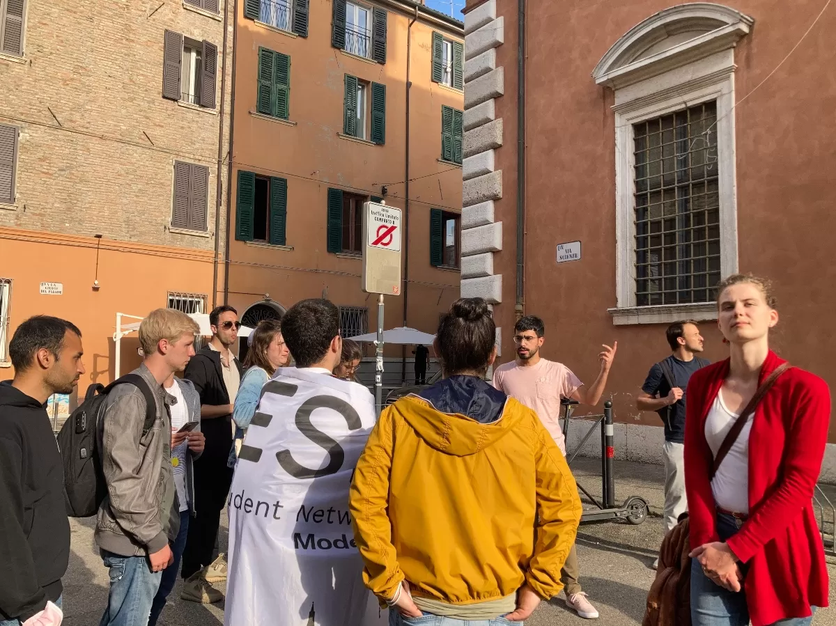 students listening to a guide in Ferrara