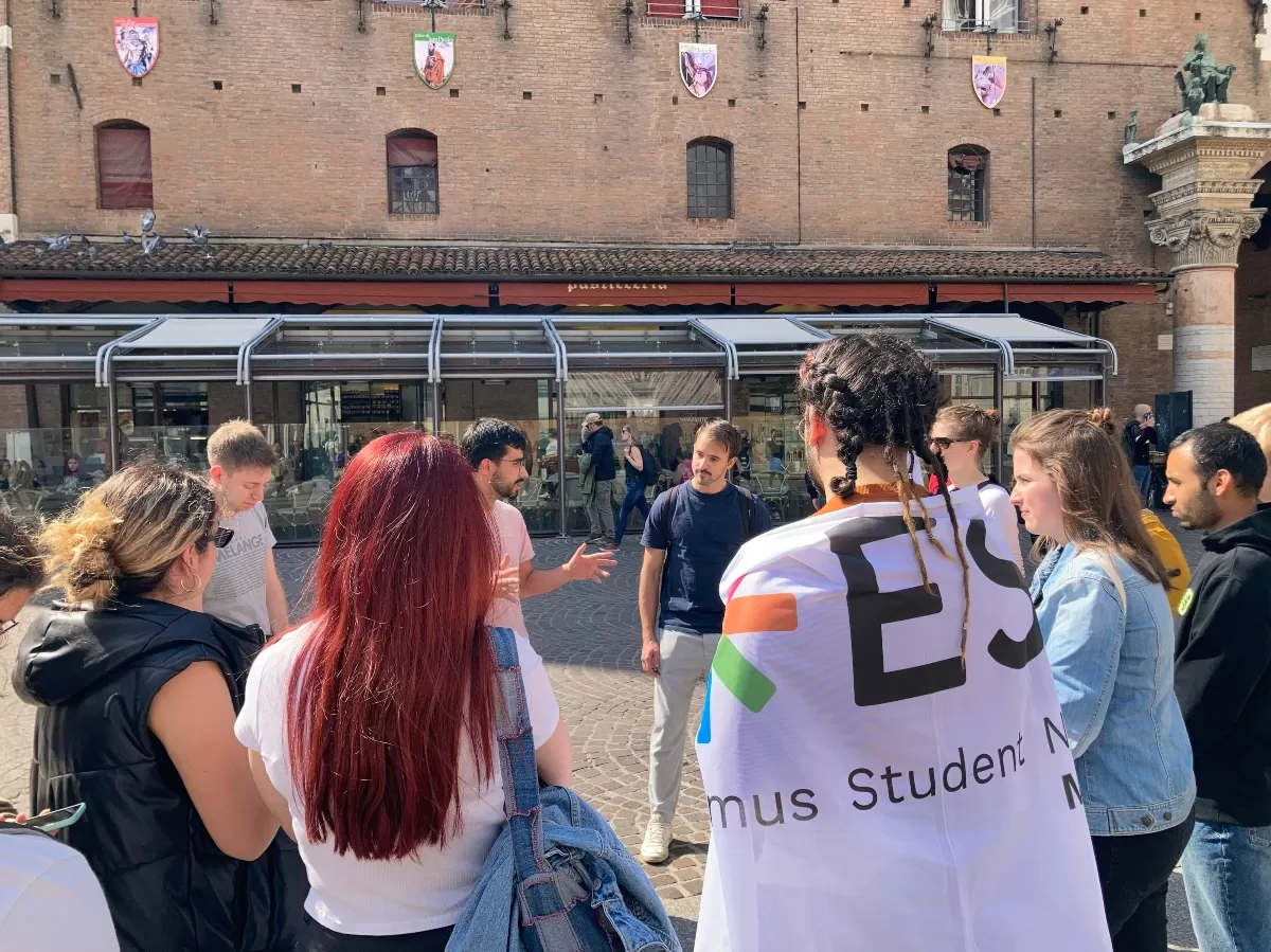 students listening to a guide in Ferrara