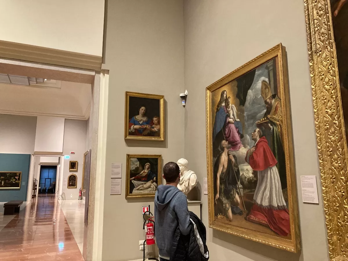 student admiring the Galleria Estense