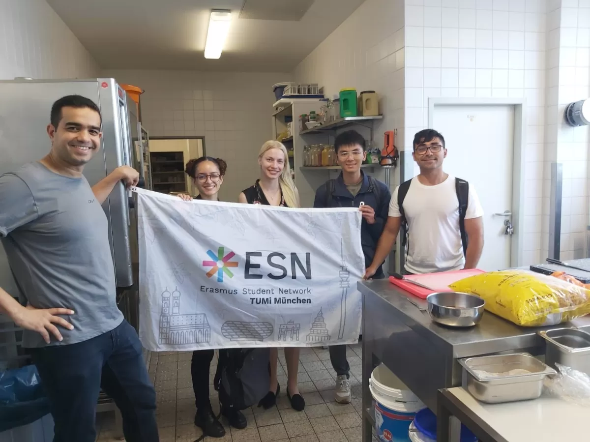 Group of international students volunteering in making and distributing food for homeless people in Munich