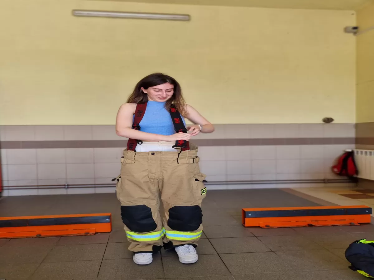 Trying firefighter's outfit on