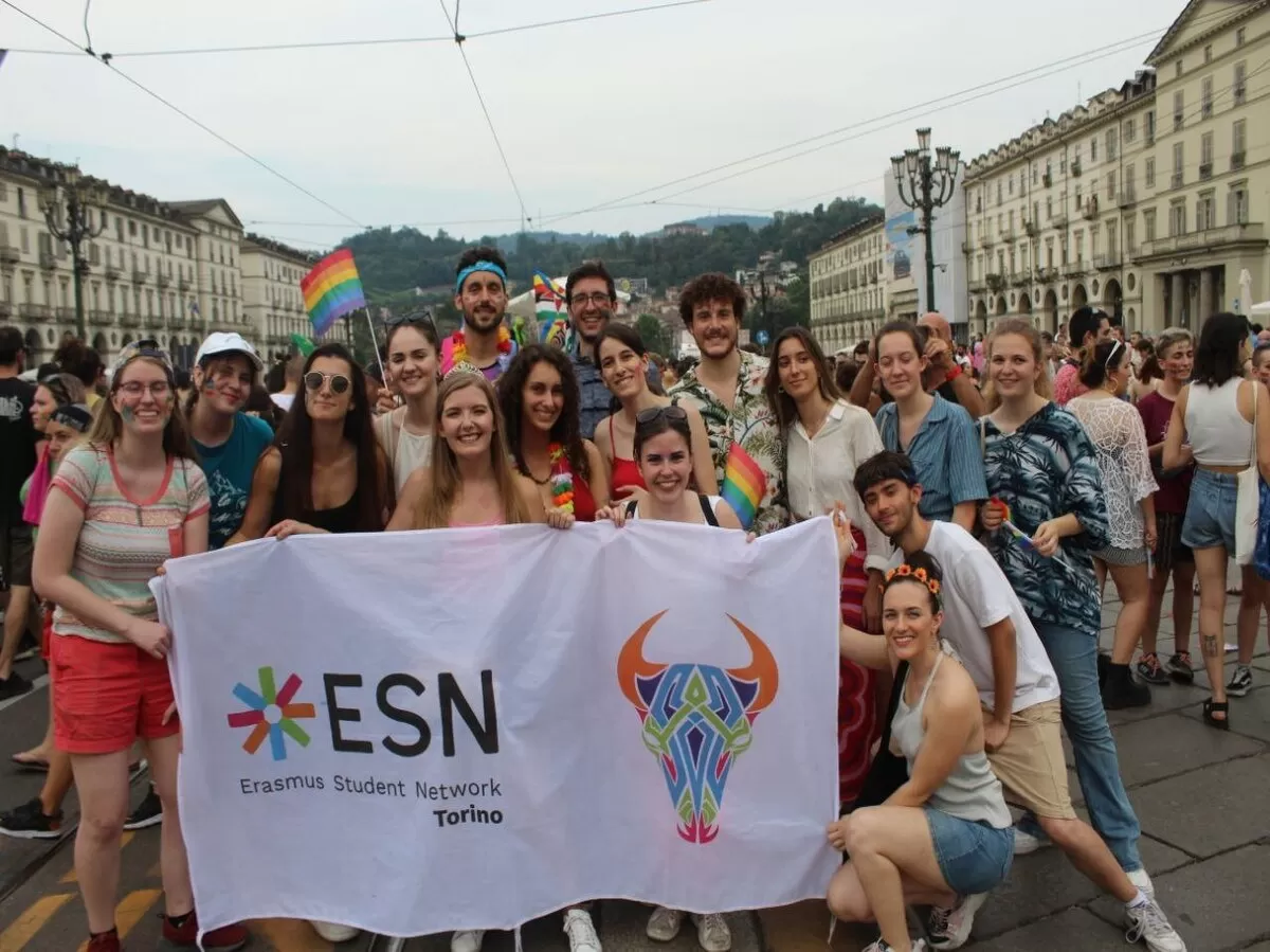 Group pictures of some participants at the end of the parade with the ESN Torino flag