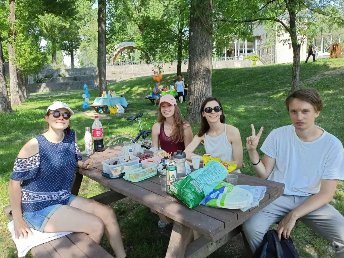 Participants at a picnic table in the park