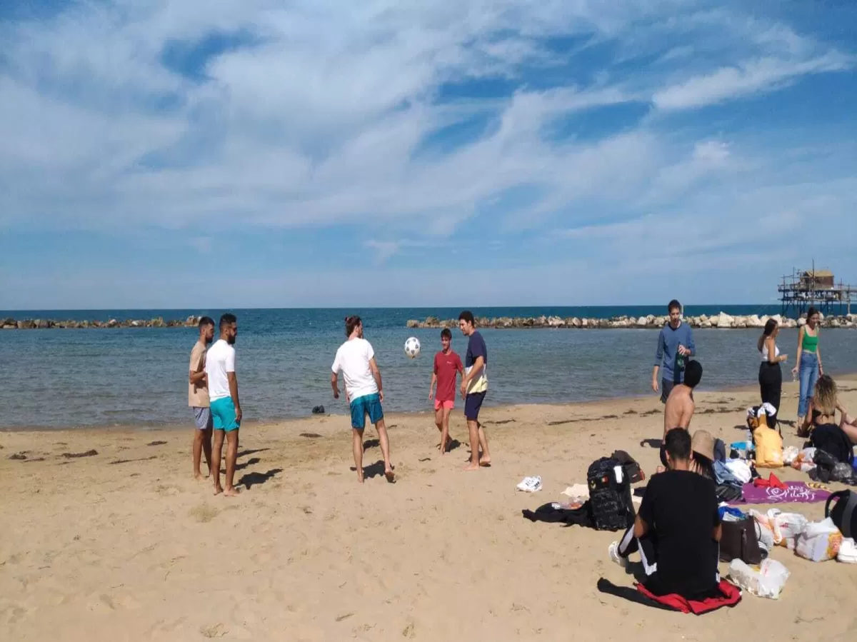 volunteers and erasmus students having fun on the beach