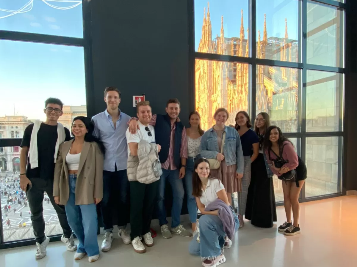 Group of international students on the fifth floor of the museum, with the Duomo in the backgroud