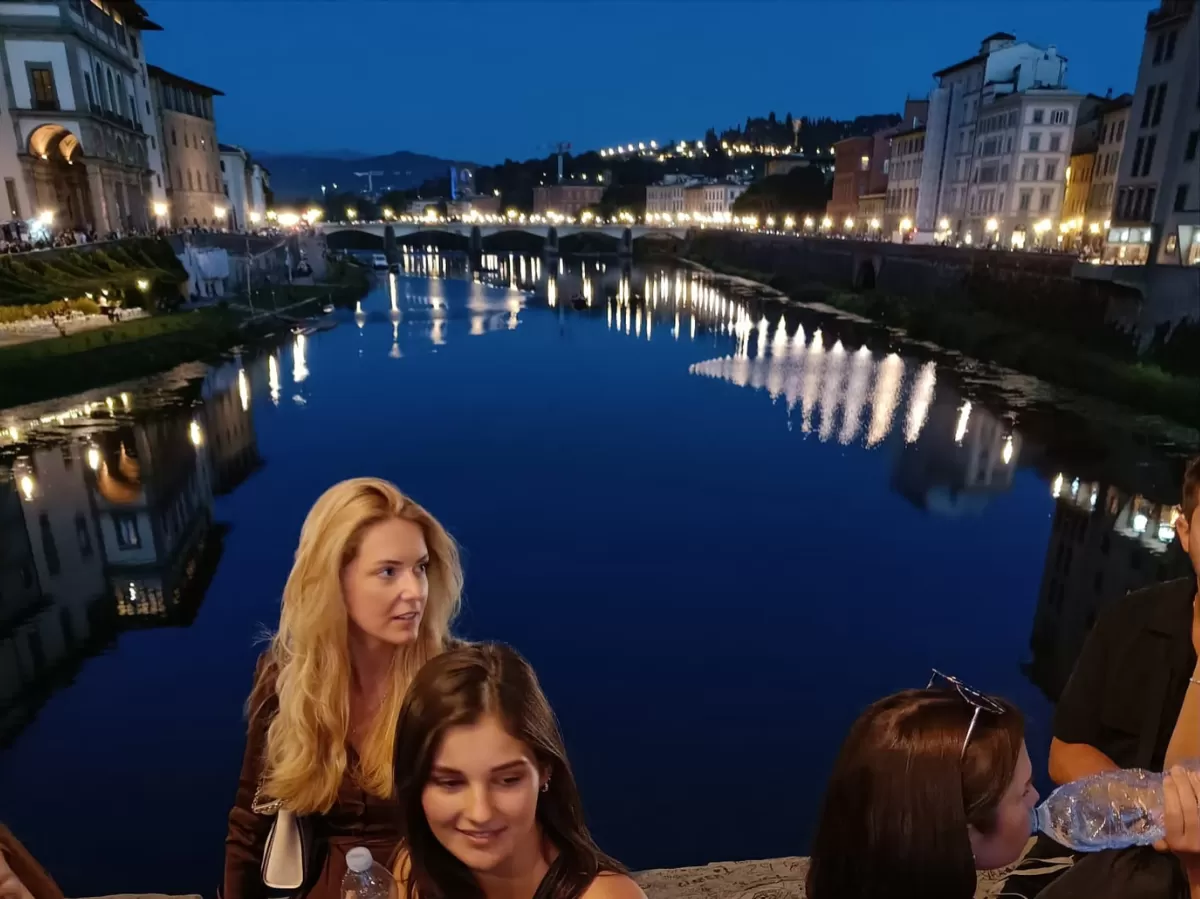 International students on a bridge on the Arno river.