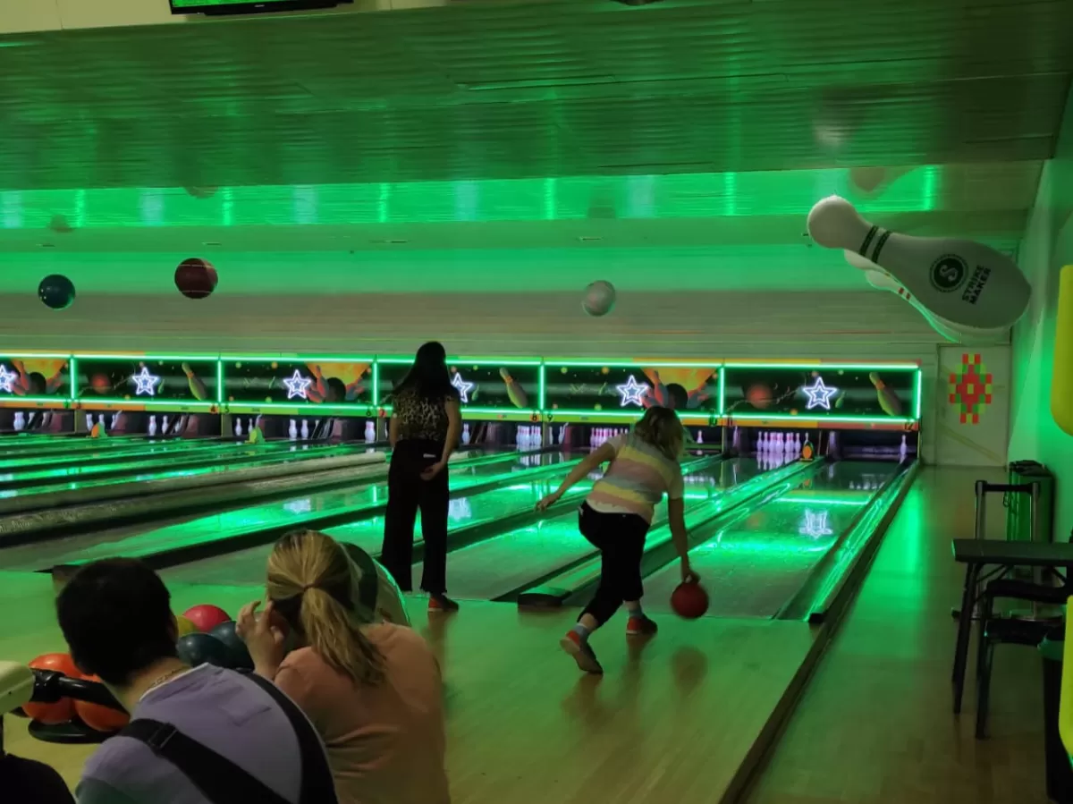 The participants playing bowling
